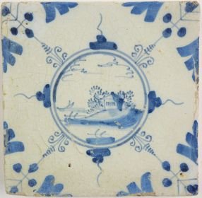 Antique Delft tile with a village, 17th century