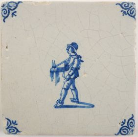 Antique Delft tile with a peddler, 17th century