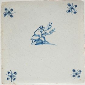 Antique Delft tile with a pipe smoker, 17th century