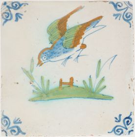 Antique Delft tile with a bird in flight, 17th century