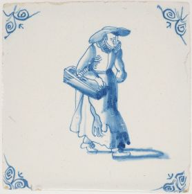 Antique Delft tile with a woman carrying goods, 17th century