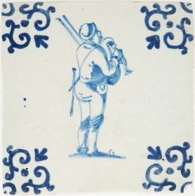 Antique Delft tile depicts a man playing on a bagpipe, 17th century