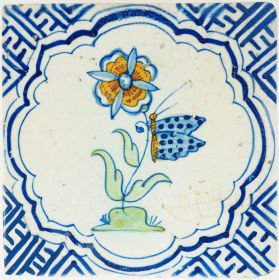 Antique Delft tile with corncockle flower, butterfly and Wanli corners, 17th century