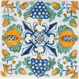 Antique Delft tile with grapes, pomegranates and central fleur-de-lis, 17th century