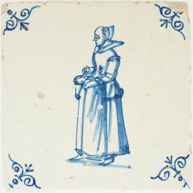 Antique Delft tile wiith a woman carrying a basket, 17th century
