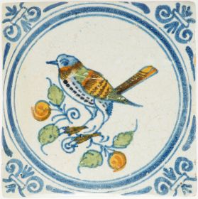 Antique Delft tile with polychrome bird on fruit branch, 17th century