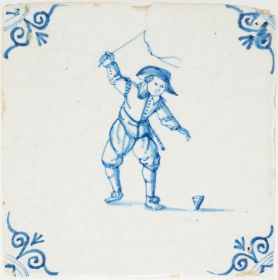 Antique Delft tile with a child playing with a spinning top, 17th century