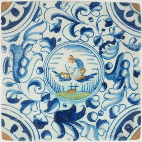Antique Delft tile with an angel’s head in a round medallion, 17th century