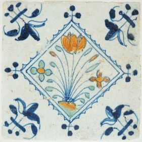 Antique Delft tile with a tulip & flowers, 17th century