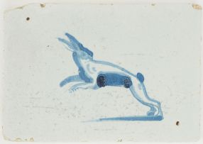 Antique Delft blue border tile with a leaping hare, 17th century