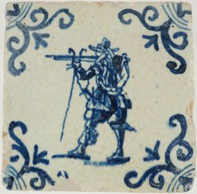Antique Delft tile in blue depicting a musketeer preparing to fire, 17th century