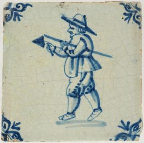 Antique Delft tile depicting a mason holding a trowel and measuring rod, 17th century
