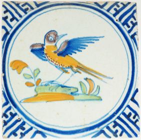 Antique Delft wall tile with a polychrome bird spreading its wings, 17th century