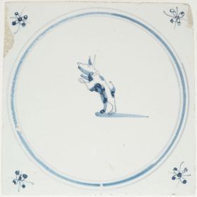 Antique Delft wall tile with a blue leaping dog, 18th century