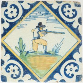 Antique Delft wall tile with a polychrome kneeling musketeer,17th century