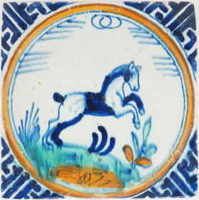 Antique Rotterdam Delft crown tile with a polychrome rearing horse, 17th century