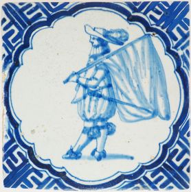 Antique Delft wall tile depicting a Dutch standard-bearer carrying a flag, 17th century