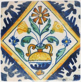 Antique Delft wall tile depicting a polychrome flower vase, 17th century
