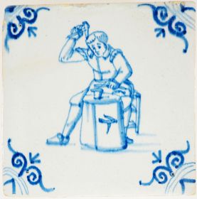Antique Delft wall tile depicting a blacksmith, 17th century