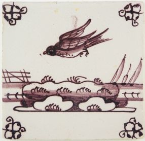 Antique Delft tile in manganese with a bird in flight, late 18th century