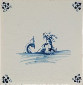 Hand-painted Delft tiles with sea creatures in blue, decorated with the spider curl corner motif and enhanced with pinholes and a crackled finish