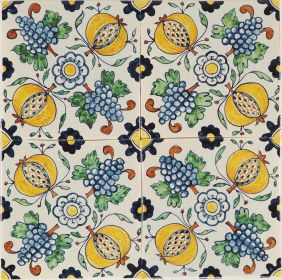 Hand-painted Delft tiles depicting pomegranates and grapes in a ornamental pattern. 