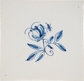 Hand-painted Delft tile sample with small flowers in blue