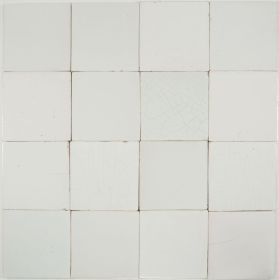 Plain white antique Dutch Delft tiles dating from around 1900