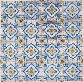 19th-century Delft wall tiles with wall flower pattern on brick background, repeating floral design
