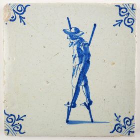 Antique Delft tile with a child walking on stilts, 17th century