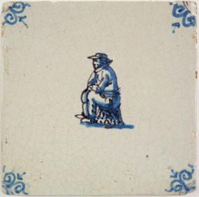 Antique Delft tile with a man resting, 17th century