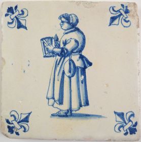 Antique Delft tile with a woman weaving, 17th century