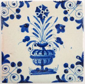 Antique Delft tile with a flower pot in blue, 17th century