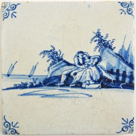 Antique Delft tile with a romantic scene, 17th century
