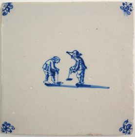 Antique Delft tile with two children playing a brick game, 17th century