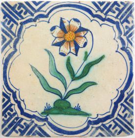 Antique Delft tile with a flower, 17th century