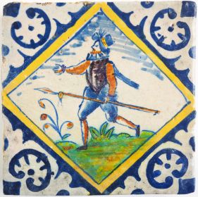 Antique Delft tile with a polychrome pikeman, 17th century