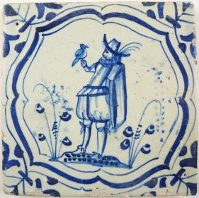 Antique Delft tile with a man with bird, 17th century