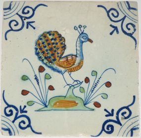 Antique Delft tile with a polychrome peacock, 17th century 