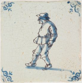 Antique Delft tile with a man strolling through town, 17th century