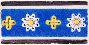 Antique Delft tile border in blue, yellow and manganese with a cross inspired pattern, 19th century