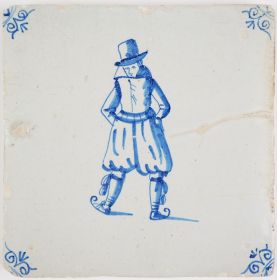 Antique Delft tile in blue with a man on ice skaters, 17th century Winter Scene