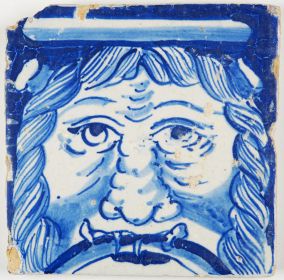 Antique Dutch Delft tile in blue with the portrait of a savage man, 17th century 