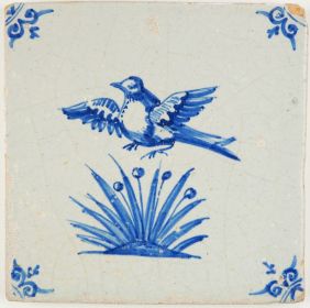 Antique Delft tile with a bird flying from the high grass and becoming a target for the hunter, 17th century