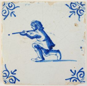 Antique Delft tile with a young man shooting a rifle, 17th century