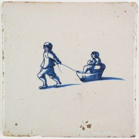 Antique Dutch Delft tile with two children in and towing a sledge, 17th century