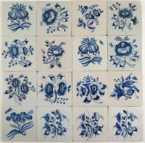 Antique Dutch Delft wall tiles with large flowers in blue