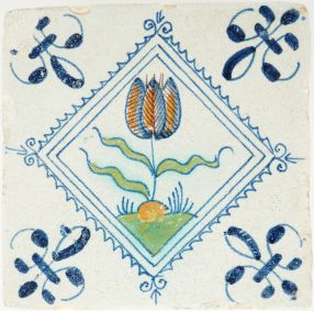 Antique Delft tile with a tulip, 17th century