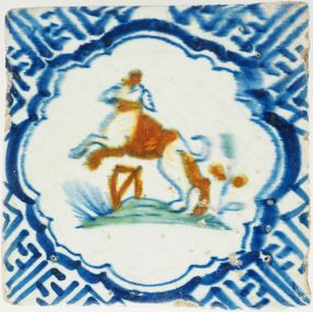 Antique Delft tile with polychrome dog and Wanli corners, 17th century