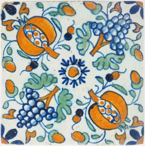 Antique Delft tile with pomegranates and grapes in rosette pattern, 17th century